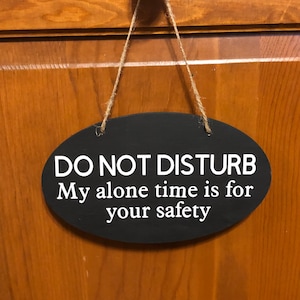 Do not disturb my alone time is for your safety. Wood, Hand Painted, Vinyl Lettering, do not disturb door hanger. 7.5&quot;x5&quot;.