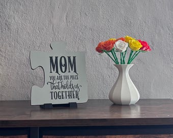Mom you are the piece that holds us together. Wood Puzzle Piece, Hand Painted, Vinyl Lettering, Mom Gift. 5" x 5.5" 3D Print Stand Included.