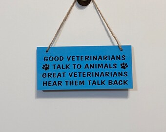 Good Veterinarians talks to animals Great Veterinarians hear them talk back. Wood, Hand Painted, Vinyl Lettering, Veterinarian. 7.5" x 3.5".