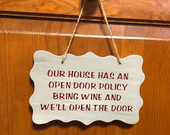 Our house has an open-door policy bring wine and we'll open the door. Wood, Hand painted, Vinyl lettering, Hanging sign. 7.5"x5".