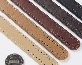 May include: Five leather straps in different colors, including beige, brown, and black. The straps have a textured surface and are perforated with small holes. A Chinese coin is included for scale.