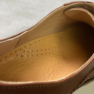 Orthotic leather insole with arch support