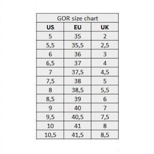 May include: A size chart for shoes, showing US, EU, and UK sizes. The chart shows sizes from 5 to 10.5 US, 35 to 41.5 EU, and 2 to 8.5 UK.