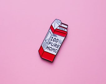 May include: A red and white enamel pin shaped like a milk carton with the text "100% PURE HOMO" on the front.