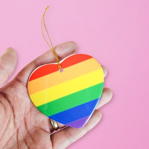 Gay pride ornament - This cute lgbtq ornament features the rainbow pride flag and is a great pride gift. A perfect gay pride holiday gift