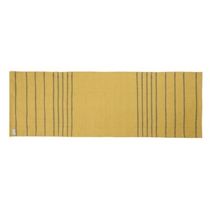 May include: A yellow and gray striped runner rug. The rug has a subtle texture and is made of a woven material.