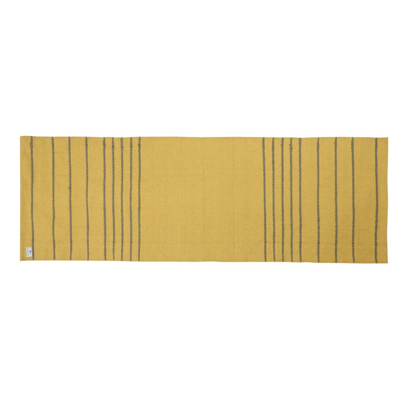 May include: A yellow and gray striped runner rug. The rug has a subtle texture and is made of a woven material.