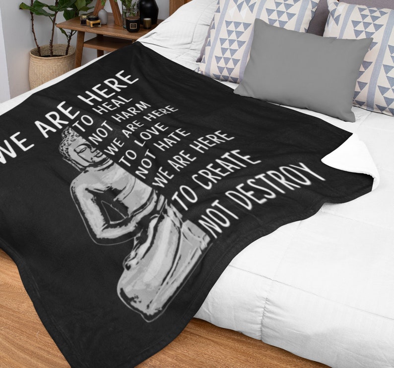 May include: Black throw blanket with a white Buddha image and the text "We are here to heal, not harm, to love, we are here, not hate, we are here to create, not destroy".