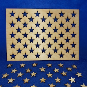 May include: A wooden board with 50 star-shaped cutouts, and 50 individual wooden stars. The board and stars are light brown in color.