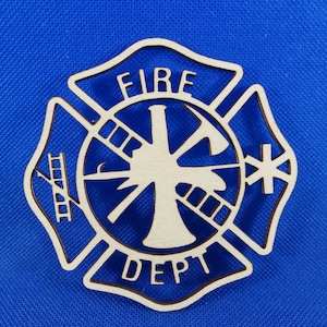 May include: A wooden cutout of a fire department emblem. The emblem is a red cross with a fire hose, axe, and ladder inside. The words "FIRE DEPT" are written around the outside of the cross.