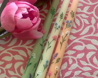 hand painted taper candles painted in a springtime design. sold in pairs