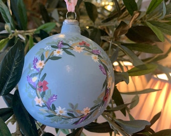 Hand painted ceramic bauble height 9cms width 9cms. various designs can be personalised with a single letter.