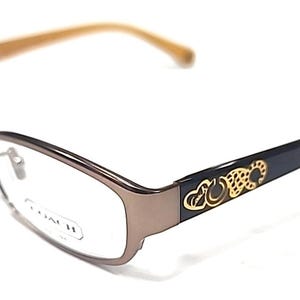 May include: A white ceramic mug with a black handle and the text "But First, Coffee" in a handwritten style. The mug is on a white surface. The mug is 4 inches tall.