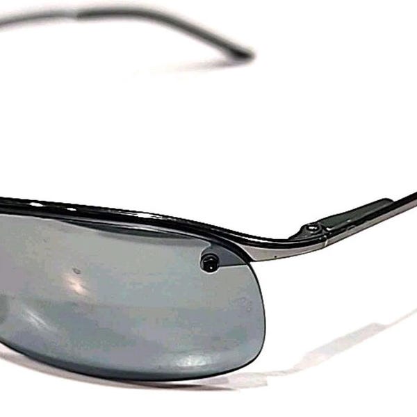 Gafas de sol Ray-Ban RB3183 004/82 con montura superior plateada y envolvente, talla 63-15 125, en muy buen estado.