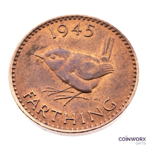 May include: A 1945 British farthing coin made of copper, featuring a wren bird design and the inscription "FARTHING" around the edge.