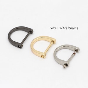 May include: Three D-shaped metal buckles in gunmetal, gold, and silver finishes. Each buckle has a straight bar and screw detail. The text "Size: 3/4" (19mm)" is displayed.