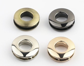 May include: Four metal grommets in different finishes: antique brass, black, silver, and gold. Each grommet has a 10mm inner diameter.
