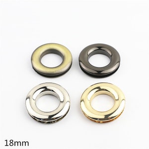 May include: Four metal grommets in different finishes: gold, silver, black, and antique gold. Each grommet is 18mm in diameter.