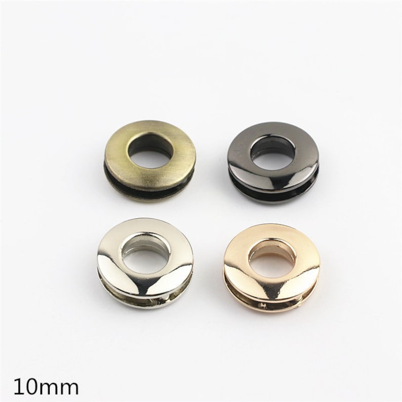 May include: Four metal grommets in different finishes: antique brass, black, silver, and rose gold. Each grommet has a 10mm inner diameter.