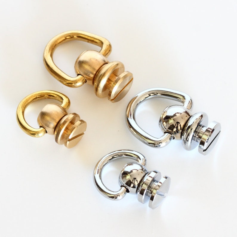 May include: Three metal swivel snap hooks with screw posts. Two are gold and one is silver.