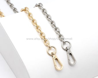 May include: Two metal chains with lobster clasps. One chain is gold and the other is silver.