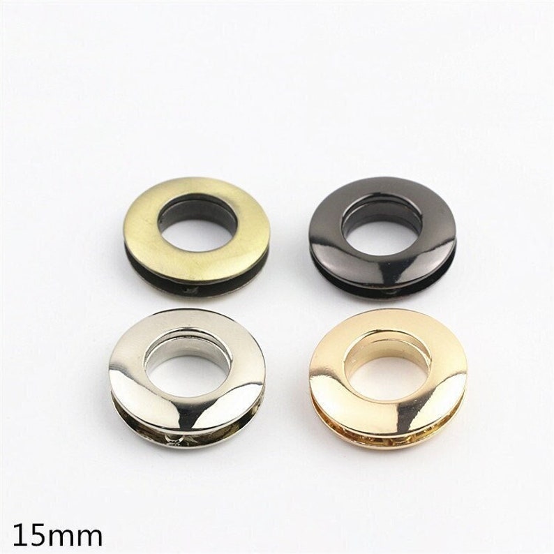 May include: Four metal eyelets in different finishes: gold, silver, brass, and black. Each eyelet has a 15mm diameter.