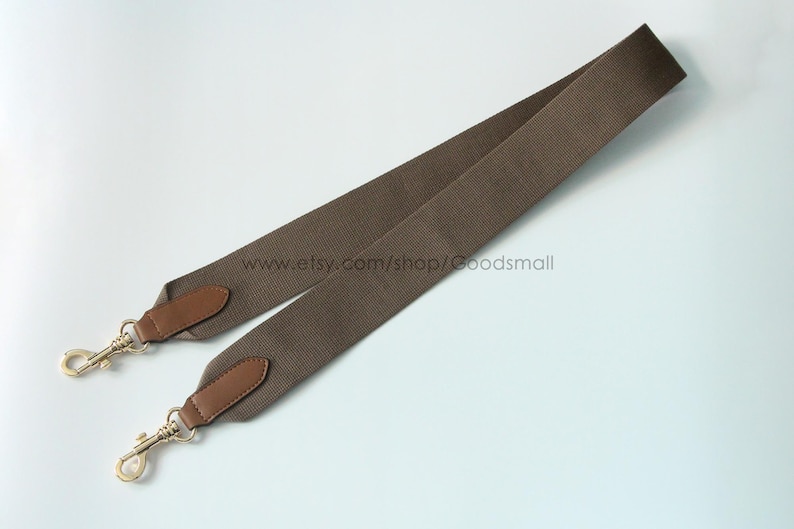 May include: A brown canvas bag strap with leather accents and gold-colored metal clasps. The strap is angled across a white background. The Etsy shop name www.etsy.com/shop/Goodsmall is visible.