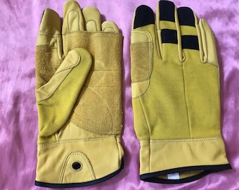 May include: A pair of yellow leather work gloves with black accents. The gloves have a reinforced palm and fingers, and a breathable mesh back.