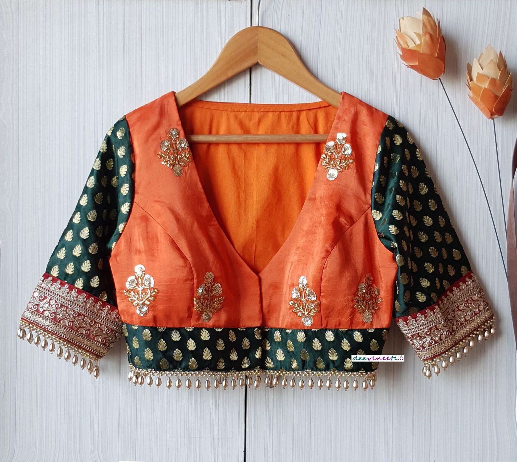 orange saree with dark green blouse