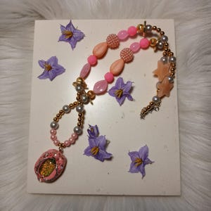 Collana Vulva scintillante rosa/argento/oro