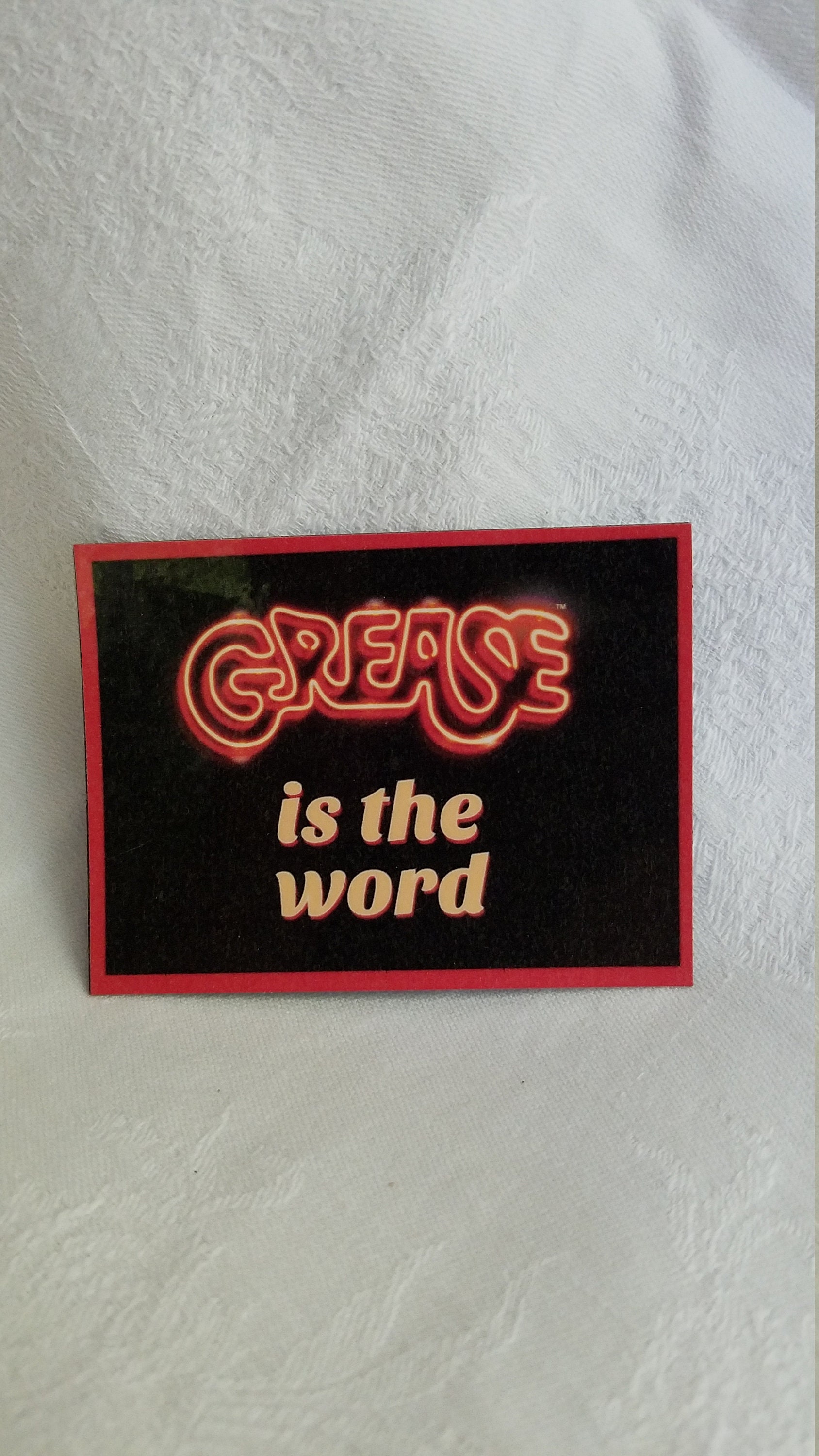Grease Is The Word Logo