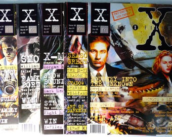 May include: A collection of vintage X-Files magazines. Each cover features images of the show's stars and episode titles. The magazines are from the 1990s, with issue numbers and dates visible. The text "The Truth is Out There" is also visible.