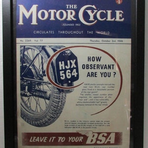 May include: A vintage magazine advert for BSA motorcycles. The advert features a close-up of a motorcycle's rear wheel with a number plate that reads "HJX 564". The advert text reads "How observant are you?" and highlights the new B.S.A. rear number plate design. The advert also includes the slogan "Leave it to your BSA."
