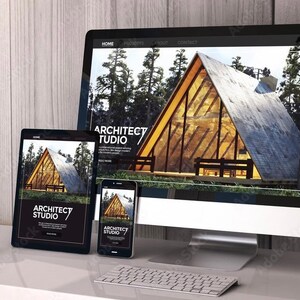 May include: A website design for an architect studio displayed on a desktop computer, tablet, and smartphone. The website features a photo of a modern, wooden A-frame house in a forest setting. The website text reads "Architect Studio".