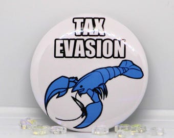 May include: A circular white pin-back button featuring a blue lobster illustration and the black text TAX EVASION printed in bold capital letters. The design is centered on the button, which has a glossy finish and a clean, simple graphic style.