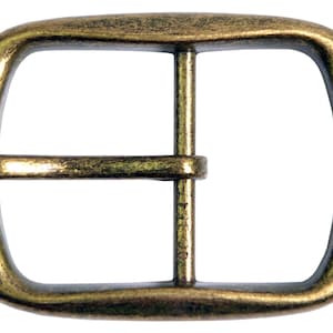 A gold-toned metal belt buckle with a rectangular shape and a smooth, slightly textured finish.