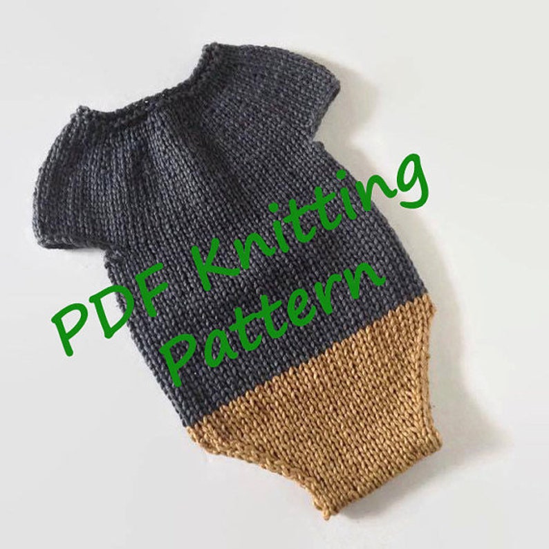 May include: A knitted baby romper in a two-tone design. The top portion is a dark gray, and the bottom is a tan color. The words "PDF Knitting Pattern" are written in green across the image. The romper has short sleeves.