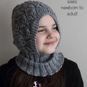 May include: A gray knitted hooded cowl with a lace pattern. The cowl is worn by a child and the text "sizes: newborn to adult" is visible in the image.