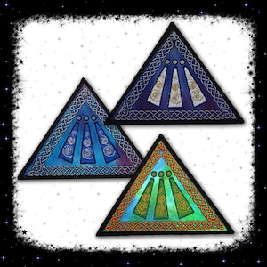 May include: Three embroidered triangular patches with a Celtic knot border. The patches are in shades of blue, green, and purple with a white, gold, and green design in the center.