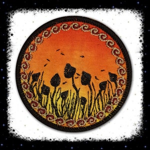 May include: A round embroidered patch with a sunset background and a silhouette of mushrooms in a field. The patch has a gold and red border with a repeating pattern.