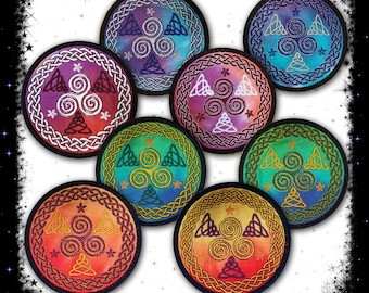 May include: Set of seven round embroidered patches featuring a Celtic knot design with a triple spiral motif. The patches are in various colors, including blue, green, purple, and red.