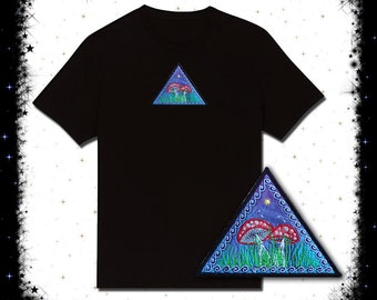 May include: Black t-shirt with a blue and green triangle patch featuring a mushroom design. The patch has a white star and a crescent moon.