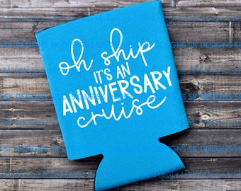 May include: A turquoise can cooler with the phrase "oh ship it's an anniversary cruise" in white script. The cooler is made of a neoprene-like material and has a cutout for the can to fit in. The background is a weathered wood.