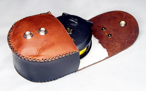 Handcrafted leather reel case. We can make them to fit any of your reels,  just reach out or visit our Custom Reel Case page! • Heirloom