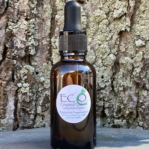 K&ouml;nnte beinhalten: Eine braune Glasflasche mit Tropfer und einem wei&szlig;en Etikett mit der Aufschrift "ECO Created Colors Nagellackverd&uuml;nner Wiederherstellung und Konservierung 10 free cruelty free vegan 1 fl oz / 29 ml"