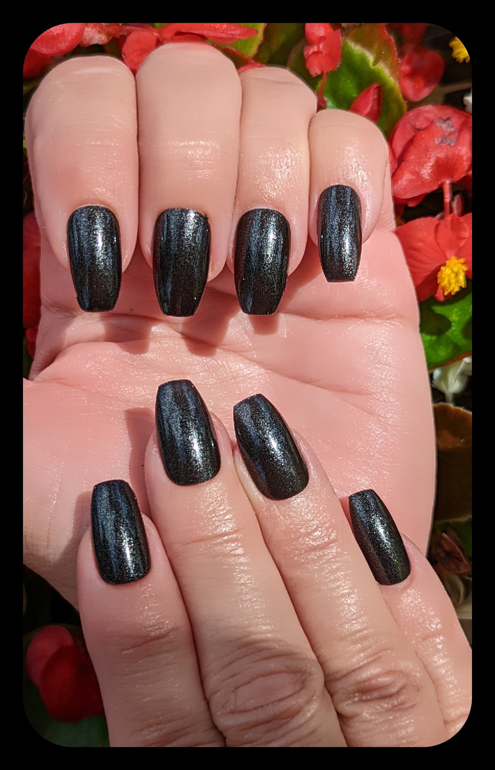 Sleek Black Metallic Nail Look