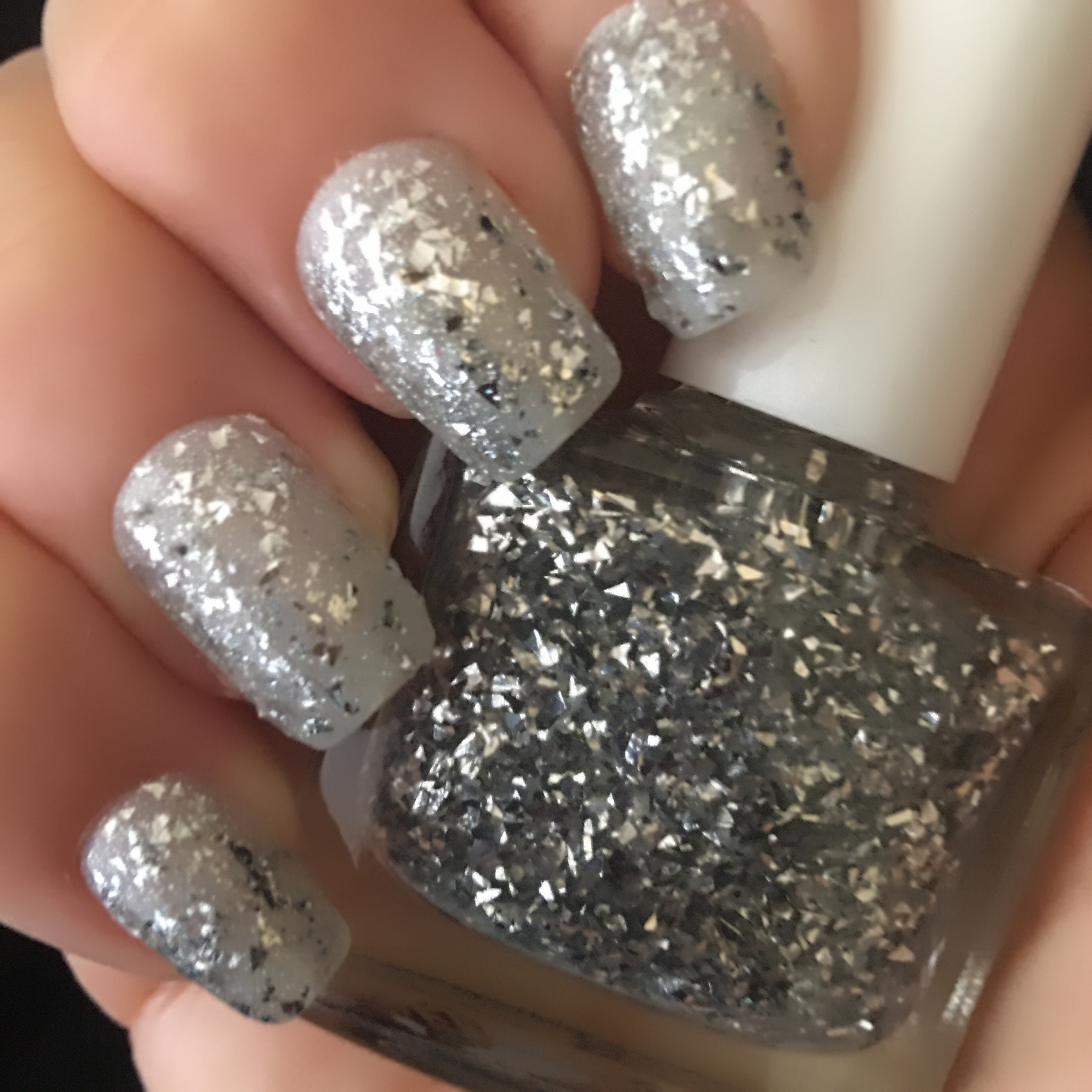 Silver nail polish with glitter deals