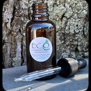 K&ouml;nnte beinhalten: Eine braune Glasflasche mit Tropfer, beschriftet mit "ECO Created Colors Nagellackverd&uuml;nner Wiederherstellung & Konservierung 10 free. cruelty free vegan 1 fl oz / 29 ml e"