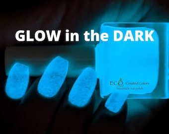 May include: A bottle of blue glow-in-the-dark nail polish with the text "ECO Created Colors handmade nail polish" on the label.