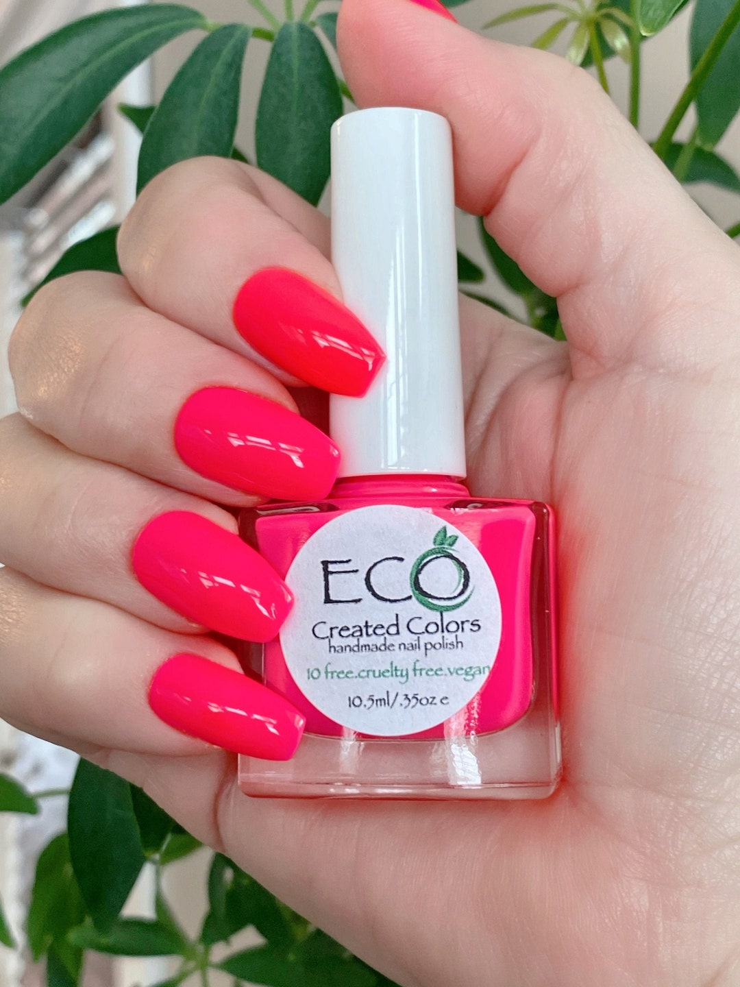 Bright watermelon pink nails with glossy finish